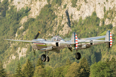Mollis, Switzerland, August 18, 2023 N-25Y Lockheed P-38L Lightning aircraft is taking off from runway 19のeditorial素材