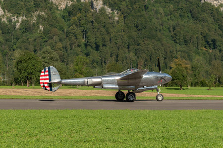 Mollis, Switzerland, August 18, 2023 N-25Y Lockheed P-38L Lightning aircrafton the runwayのeditorial素材