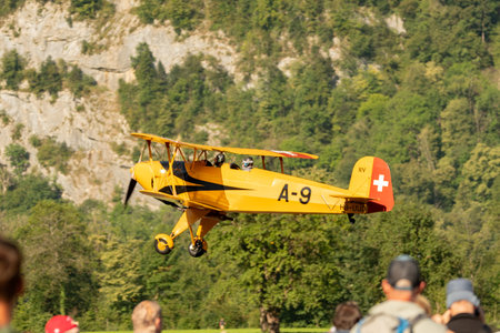 Mollis, Switzerland, August 18, 2023 HB-UUD Buecker 131 Jungmann aircraft landing on runway 19のeditorial素材