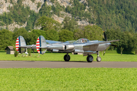 Mollis, Switzerland, August 18, 2023 N-25Y Lockheed P-38L Lightning aircrafton the runwayのeditorial素材