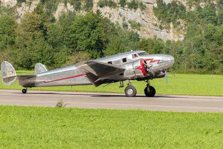 Mollis, Switzerland, August 18, 2023 NC-81125 Lockheed Model 12 Electra Junior aircraft is taxiing on the runwayのeditorial素材
