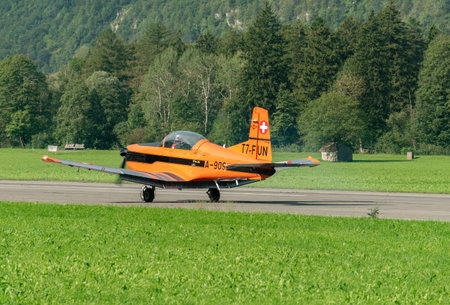 Mollis, Switzerland, August 18, 2023 Pilatus PC-7 propeller aircraft is taxiing on the runwayのeditorial素材