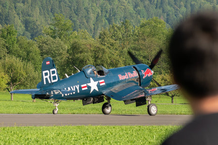 Mollis, Switzerland, August 18, 2023 OE-EAS Chance Vought F4U-4 Corsair aircraft is taxiing on the runwayのeditorial素材