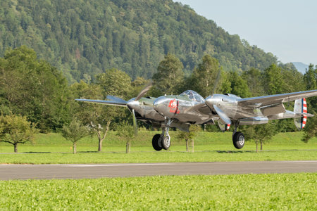 Mollis, Switzerland, August 18, 2023 N-25Y Lockheed P-38L Lightning aircrafton the runwayのeditorial素材