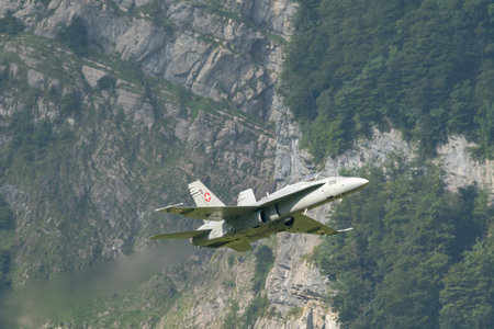 Mollis, Switzerland, August 18, 2023 Swiss military McDonnell Douglas F/A-18 Hornet jet is performing acrobatics during an air displayのeditorial素材