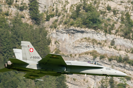 Mollis, Switzerland, August 18, 2023 Swiss military McDonnell Douglas F/A-18 Hornet jet is performing acrobatics during an air displayのeditorial素材