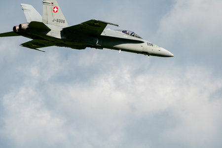 Mollis, Switzerland, August 18, 2023 Swiss military McDonnell Douglas F/A-18 Hornet jet is performing acrobatics during an air displayのeditorial素材