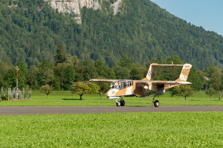 Mollis, Switzerland, August 18, 2023 F-AZKM North american OV-10B Bronco aircraft on runway 19のeditorial素材