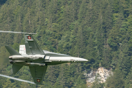 Mollis, Switzerland, August 18, 2023 Swiss military McDonnell Douglas F/A-18 Hornet jet is performing acrobatics during an air displayのeditorial素材