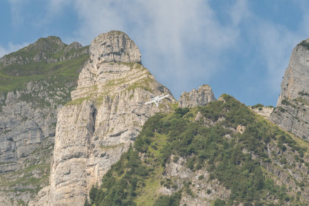 Mollis, Switzerland, August 18, 2023 Swiss military McDonnell Douglas F/A-18 Hornet jet is performing acrobatics during an air displayのeditorial素材