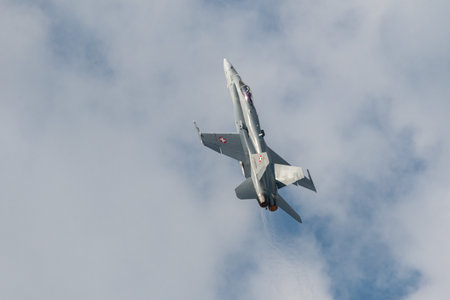 Mollis, Switzerland, August 18, 2023 Swiss military McDonnell Douglas F/A-18 Hornet jet is performing acrobatics during an air displayのeditorial素材