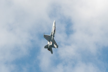 Mollis, Switzerland, August 18, 2023 Swiss military McDonnell Douglas F/A-18 Hornet jet is performing acrobatics during an air displayのeditorial素材