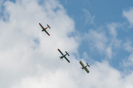 Mollis, Switzerland, August 18, 2023 Boeing E75 Stearman with a Dornier 27 and a Pilatus P-3-05 aircraft in formation flight during an air showのeditorial素材