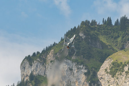 Mollis, Switzerland, August 18, 2023 Swiss military McDonnell Douglas F/A-18 Hornet jet is performing acrobatics during an air displayのeditorial素材