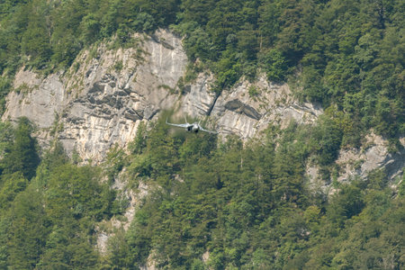 Mollis, Switzerland, August 18, 2023 Swiss military McDonnell Douglas F/A-18 Hornet jet is performing acrobatics during an air displayのeditorial素材