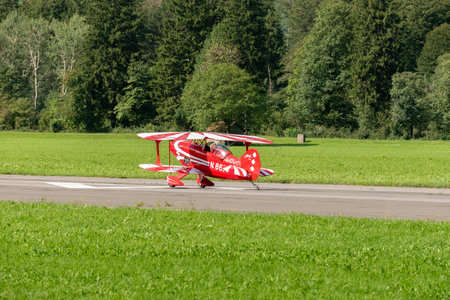 Mollis, Switzerland, August 18, 2023 N-8671 Pitts S-1S special double decker aircraft is landing on runway 19のeditorial素材