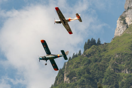 Mollis, Switzerland, August 18, 2023 Dornier 27 and a Pilatus P-3-05 aircraft in formation flight during an air showのeditorial素材