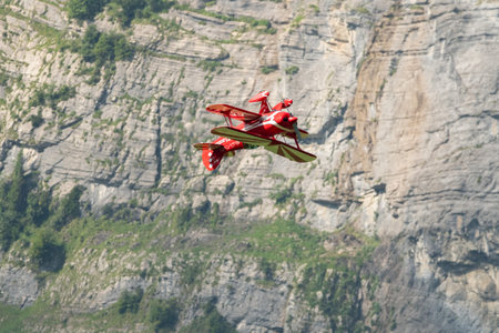 Mollis, Switzerland, August 18, 2023 N-8671 Pitts S-1S special propeller aircraft is performing acrobatics during an air displayのeditorial素材