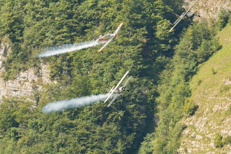 Mollis, Switzerland, August 18, 2023 Boeing E75 Stearman with a Dornier 27 and a Pilatus P-3-05 aircraft in formation flight during an air showのeditorial素材
