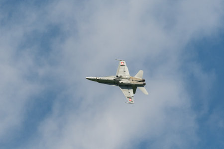 Mollis, Switzerland, August 18, 2023 Swiss military McDonnell Douglas F/A-18 Hornet jet is performing acrobatics during an air displayのeditorial素材
