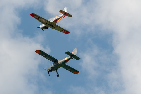 Mollis, Switzerland, August 18, 2023 Dornier 27 and a Pilatus P-3-05 aircraft in formation flight during an air displayのeditorial素材