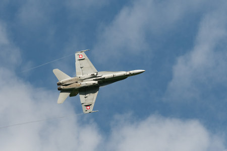 Mollis, Switzerland, August 18, 2023 Swiss military McDonnell Douglas F/A-18 Hornet jet is performing acrobatics during an air displayのeditorial素材
