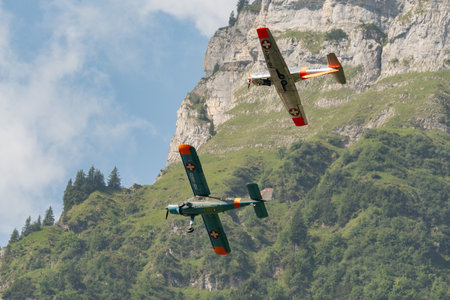 Mollis, Switzerland, August 18, 2023 Dornier 27 and a Pilatus P-3-05 aircraft in formation flight during an air showのeditorial素材