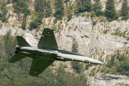 Mollis, Switzerland, August 18, 2023 Swiss military McDonnell Douglas F/A-18 Hornet jet is performing acrobatics during an air displayのeditorial素材