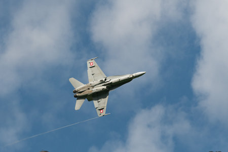 Mollis, Switzerland, August 18, 2023 Swiss military McDonnell Douglas F/A-18 Hornet jet is performing acrobatics during an air displayのeditorial素材
