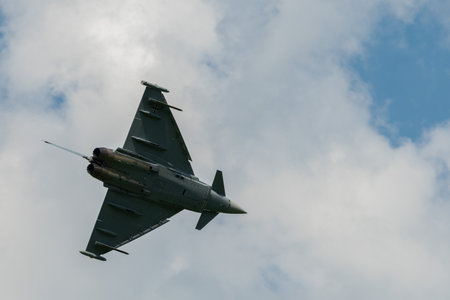 Mollis, Switzerland, August 18, 2023 Eurofighter Typhoon military jet is performing acrobatics...