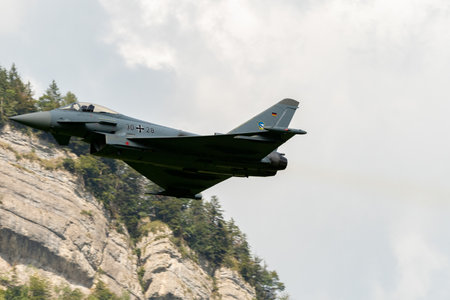 Mollis, Switzerland, August 18, 2023 Eurofighter Typhoon military jet is performing acrobatics during an air displayのeditorial素材