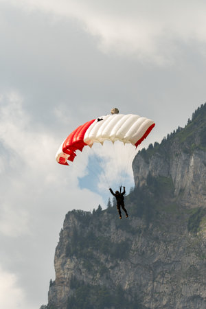 Mollis, Switzerland, August 18, 2023 Parachuters during an air displayのeditorial素材