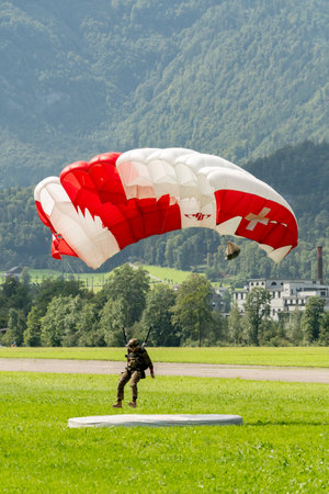 Mollis, Switzerland, August 18, 2023 Parachuters during an air displayのeditorial素材