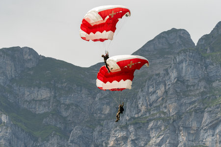 Mollis, Switzerland, August 18, 2023 Parachuters during an air displayのeditorial素材