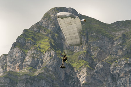 Mollis, Switzerland, August 18, 2023 Swiss Parawings in an alpine scenery during an air displayのeditorial素材