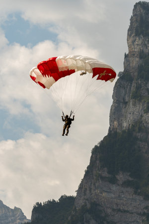 Mollis, Switzerland, August 18, 2023 Parachuters during an air displayのeditorial素材