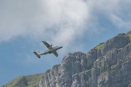 Mollis, Switzerland, August 18, 2023 C-FPSH Dornier 228.202 aircraft during an air show in the alpsのeditorial素材