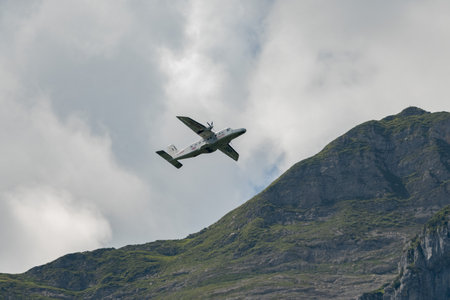 Mollis, Switzerland, August 18, 2023 C-FPSH Dornier 228.202 aircraft during an air show in the alpsのeditorial素材