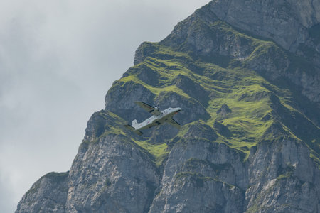 Mollis, Switzerland, August 18, 2023 C-FPSH Dornier 228.202 aircraft during an air show in the alpsのeditorial素材