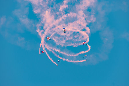 Mollis, Switzerland, August 18, 2023 RAF Falcons Parachuters are doing a performance with a lot of...