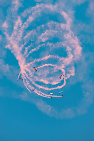 Mollis, Switzerland, August 18, 2023 RAF Falcons Parachuters are doing a performance with a lot of smoke during an air displayのeditorial素材