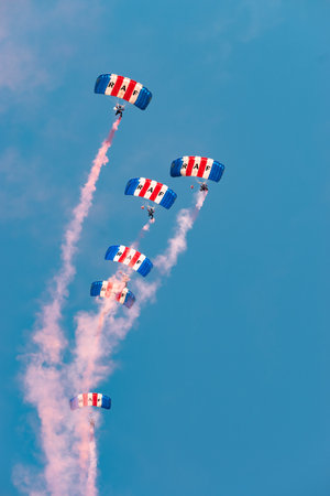 Mollis, Switzerland, August 18, 2023 RAF Falcons Parachuters are doing a performance with a lot of smoke during an air displayのeditorial素材