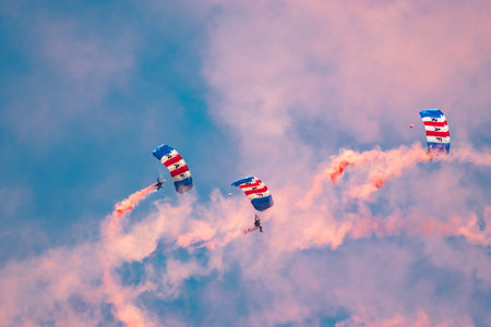 Mollis, Switzerland, August 18, 2023 RAF Falcons Parachuters are doing a performance with a lot of smoke during an air displayのeditorial素材
