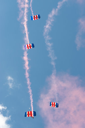 Mollis, Switzerland, August 18, 2023 RAF Falcons Parachuters are doing a performance with a lot of smoke during an air displayのeditorial素材