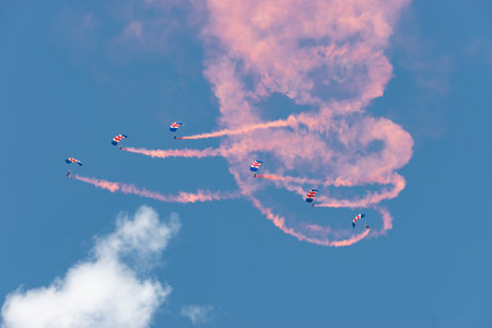 Mollis, Switzerland, August 18, 2023 RAF Falcons Parachuters are doing a performance with a lot of smoke during an air displayのeditorial素材