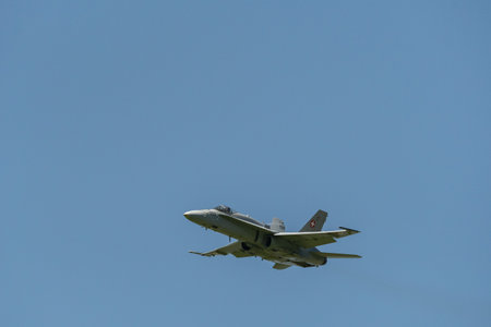 Mollis, Switzerland, August 18, 2023 Swiss military McDonnell Douglas F/A-18 hornet fighter is doing performances during an air displayのeditorial素材