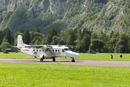 Mollis, Switzerland, August 18, 2023 C-FPSH Dornier 228-202 aircraft is taxiing on the runwayのeditorial素材