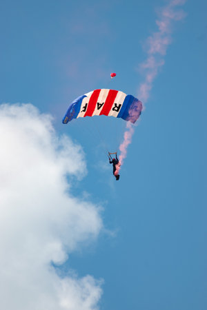 Mollis, Switzerland, August 18, 2023 RAF Falcons Parachuters are doing a performance with a lot of smoke during an air displayのeditorial素材