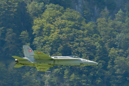 Mollis, Switzerland, August 18, 2023 Swiss military McDonnell Douglas F/A-18 hornet fighter is doing performances during an air displayのeditorial素材