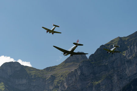 Mollis, Switzerland, August 18, 2023 Douglas DC-3C and Beechcraft Model 18 nostalgic aircraft performance during an air showのeditorial素材